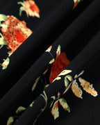 Vestido largo negro de manga corta con estampado floral y cuello en V