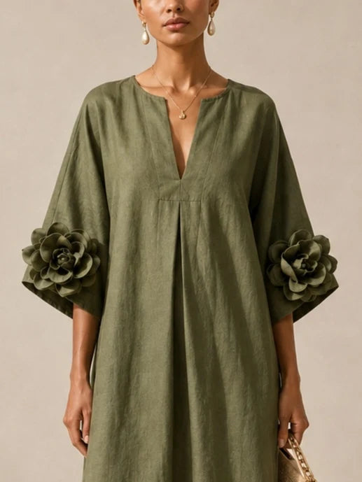 Vestido midi verde oliva con escote en V y llamativos puños florales.