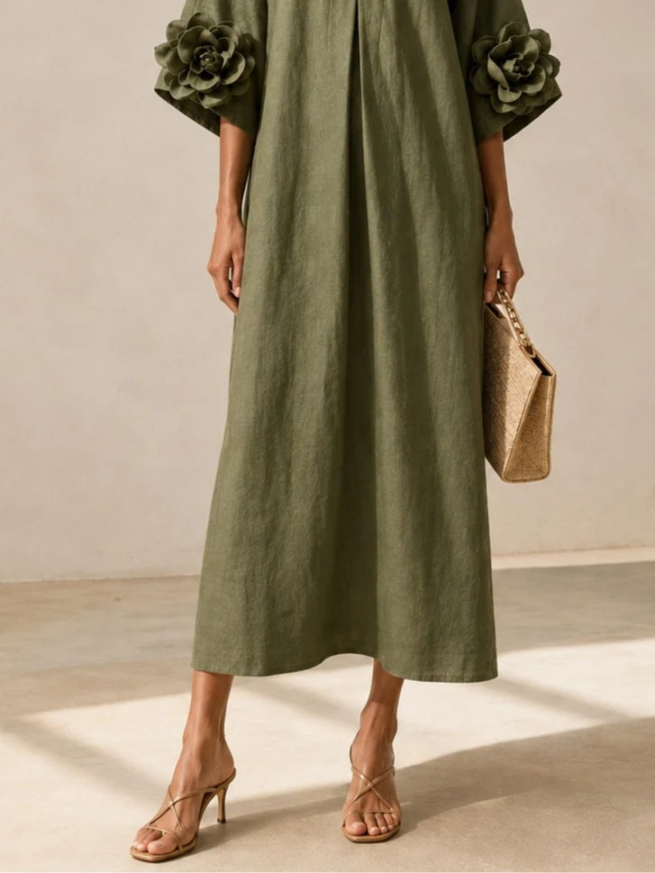 Vestido midi verde oliva con escote en V y llamativos puños florales.