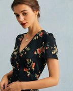 Vestido largo negro de manga corta con estampado floral y cuello en V