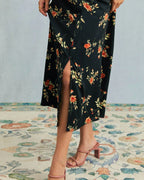 Vestido largo negro de manga corta con estampado floral y cuello en V